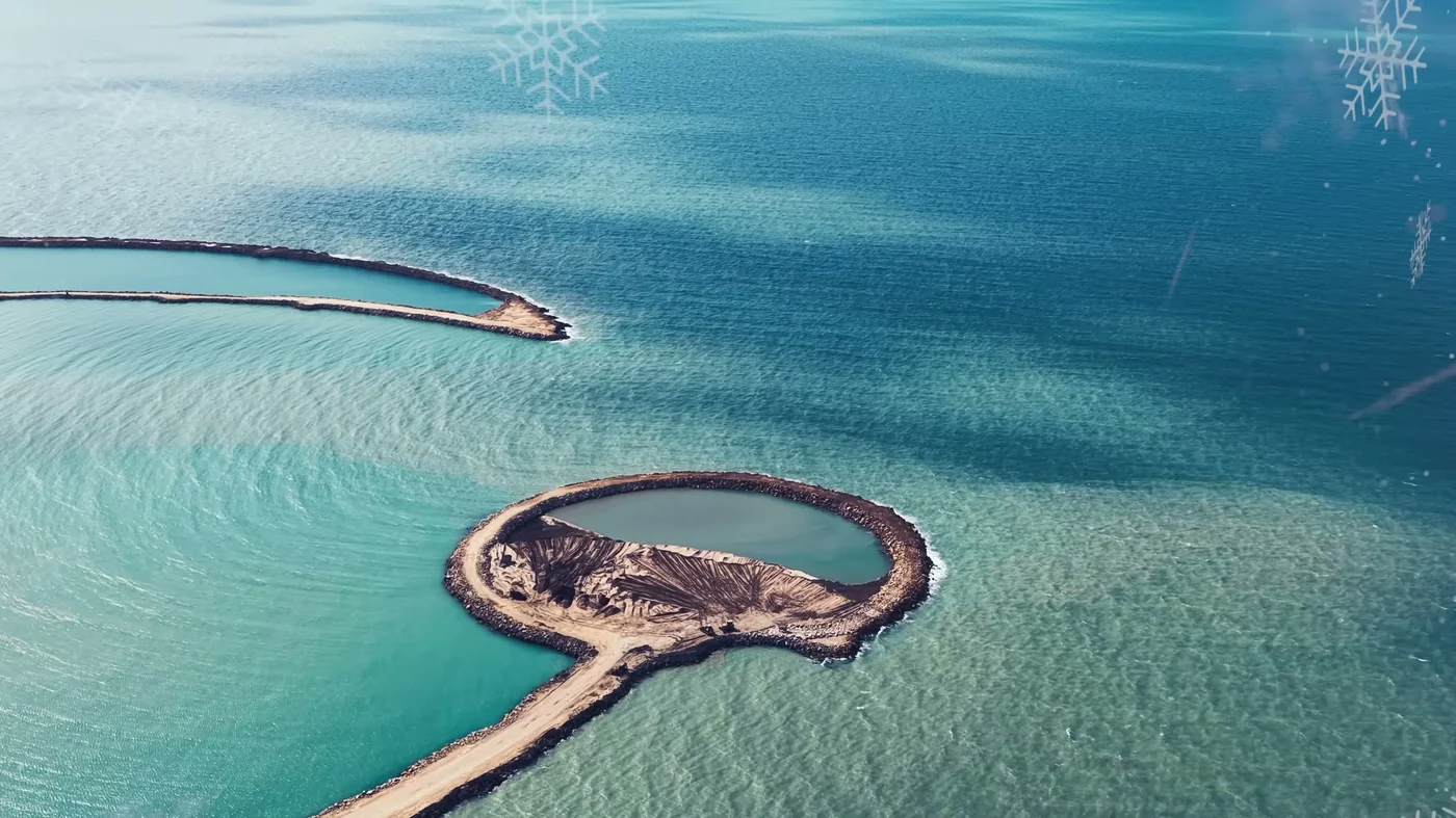 The reclaimed Halfmoon crescent and breakwater in turquoise water