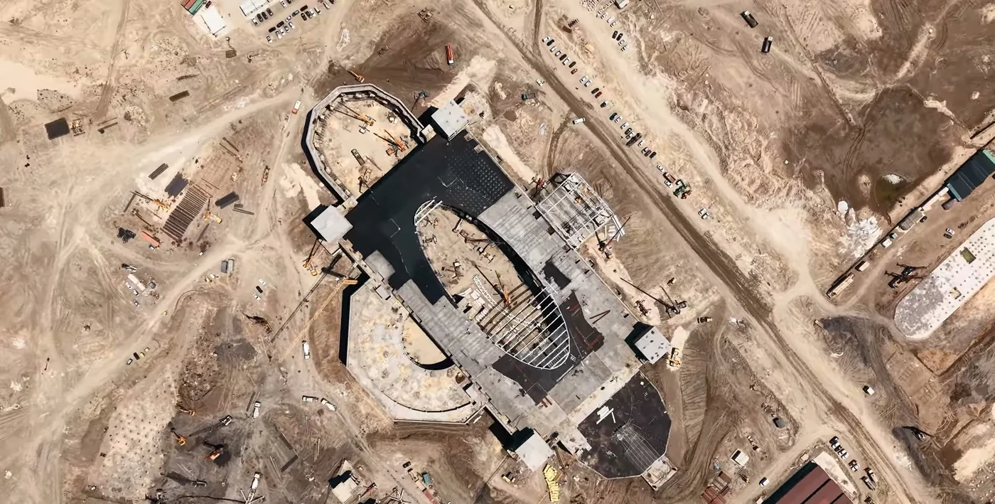 The building's outline from above: machinery on site