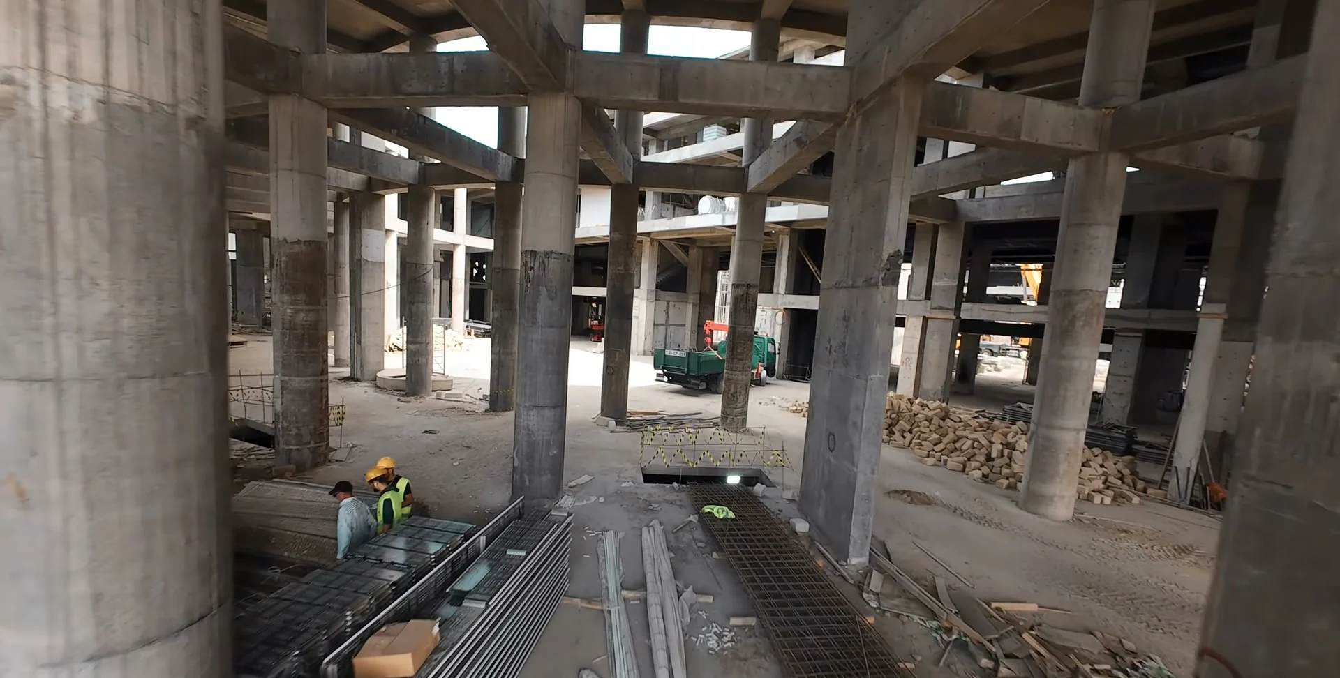 The colonnade inside the building, workers on site